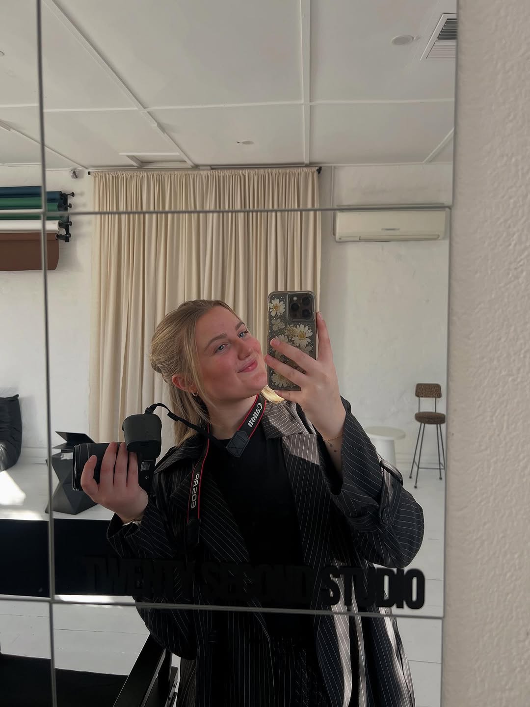 Jordan Lavis in the studio with her
              Canon camera